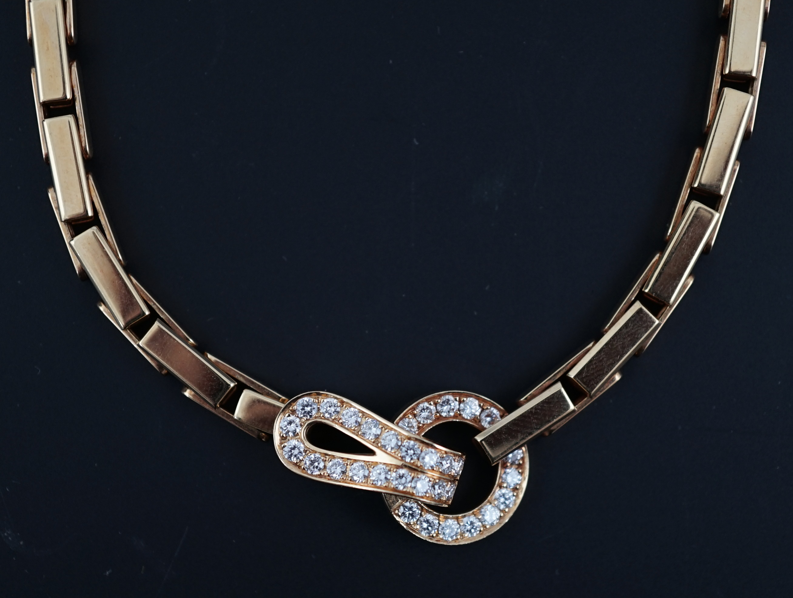 A modern Cartier 18ct gold necklace, with diamond cluster set clasp